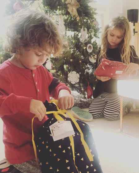Moon Bloodgood and Grady Hall's daughters opening their christmas gift. Know more about their children' birth details.