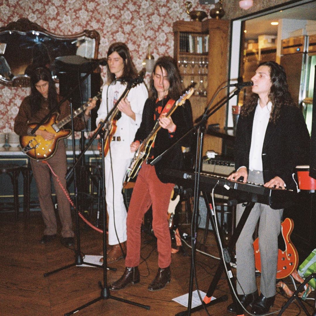 Dylan (In White) with his band, The Rubber Souls
