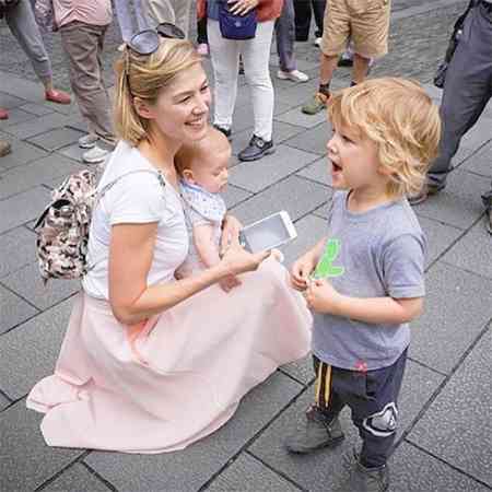 Solo Uniacke with his mother, Rosamund Pike and brother, Atom Uniacke. Know more about Solo's birth details and interesting facts.