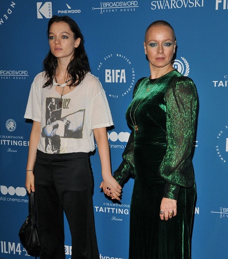 Esme Creed-Miles's holding her mother Samantha Morton's hand