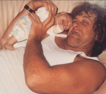 Baby Jesse Money Laying On Her Dad's Arm