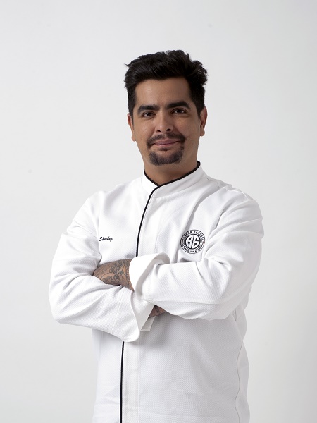 Aaron Sanchez in his professional chef clothes