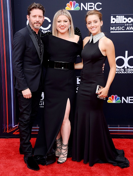Savannah Blackstock with her father Brandon and step-mom Kelly Clarkson
