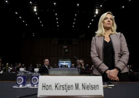 Kirstjen Nielsen standing in front of the Senate Judiciary Committee to disclose her financial status in the Public Financial Disclosure Report. Do you Nielsen wrote 'None' in the spousal section.