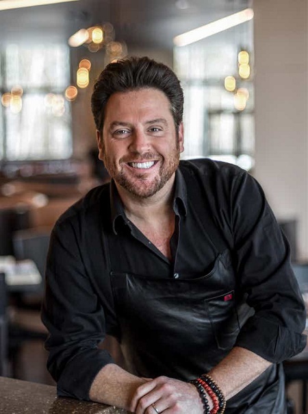 Scott Conant, husband of Meltem Conant posing for a picture at restaurant