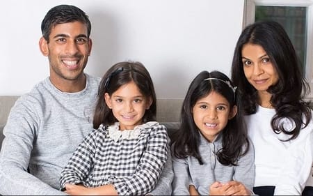 Rishi Sunak with his wife and two daughters at his home