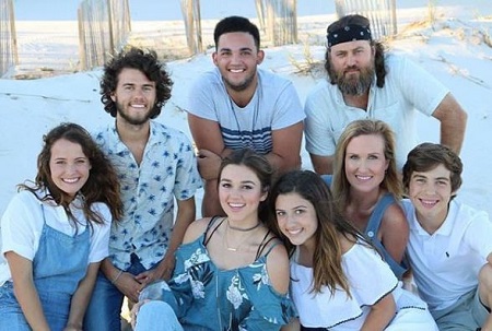 John Luke Robertson (top left) with his parents and siblings Rebecca, Sadie, Bella (sisters), and Will, Rowdy Robertson (brothers).