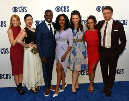 The actress Jessica Camacho (red dress) with the All Rise cast members.