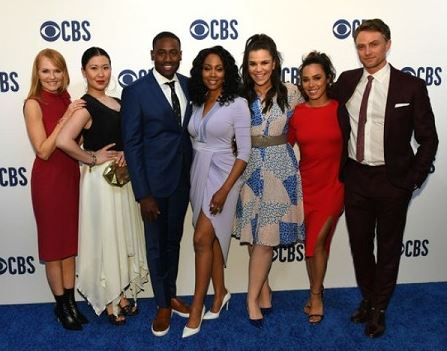 The actor J. Alex Brinson (blue tuxedo) with the All Rise cast members.