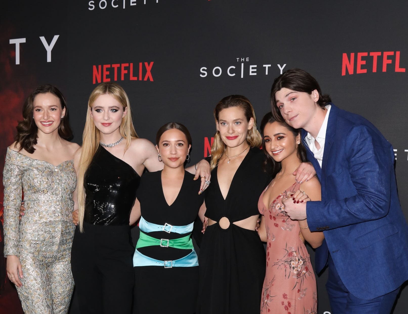 Olivia with her co-actors from Netflix's The Society series, attending an event show. 