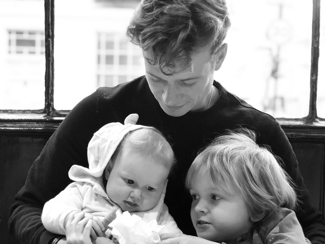 Asia's husband Ed Speleers with their two children.