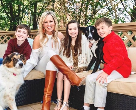 : Karin Fulford with her three children and two pet dogs.