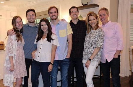 Andy (right) with his wife Sandra (second from right), sons Andrew (third from right), Garrett (fourth from right), daughter, Allie (left), son-in-law, Clay Cooney (second from left), and daughter-in-law, Danielle (third from left).