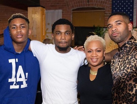 Mike Holston (right) with his mother, Latiqua Williams, and brothers, Randy (left), Nie Williams (second from right).