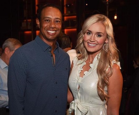 Blair O'Neal with the legendary golf player Tiger Woods. 