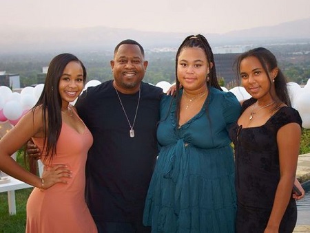 Jasmine Page Lawrence (left) with her father and half-sisters, Iyanna Faith (right), Amara Trinity (second from right).