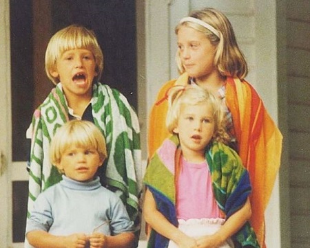 The childhood image of Sarah Bloomquist with her three siblings. 