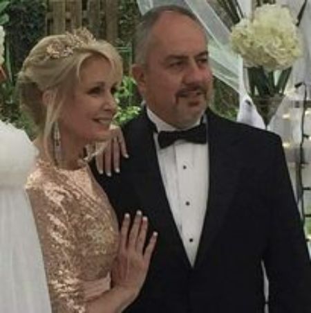 Paige Beck with her beloved husband, Jack Jacobs during their friend's wedding ceremony. How much salary does Paige earn at WCJB-TV?