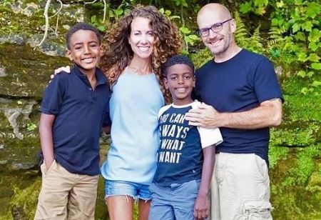 Maria Emmerich and Craig Emmerich with their adopted sons Kai and Micah.
