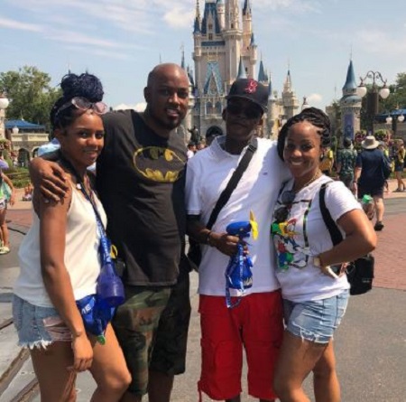 Brooke Payne (second from right) with his kids, Randy, Daija (left), and Keishina (right).