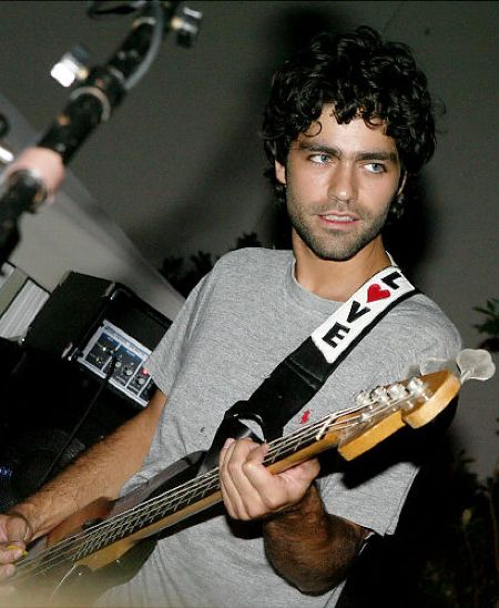 Adrian Grenier at his young age playing guitar.