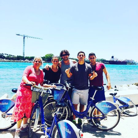 Efraim Dilveroli with his family riding citi bikes.