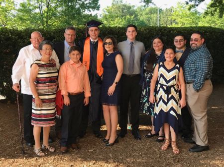 Maribel Perez Wadsworth celebrating her older son's graduation ceremony with the whole family. Who are Maribel's parents and siblings?