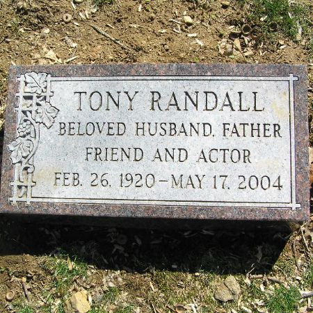 Heather Harlan's late husband, Tony Randall's headstone in Westchester Hills Cemetery. How much is Harlan's net worth as of 2021?