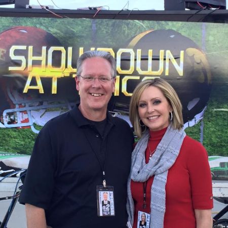Karen Fuller with her awesome TV husband, Scott Sanborn at the Iowa Hawkeyes match day. How old is Karen as of 2021?