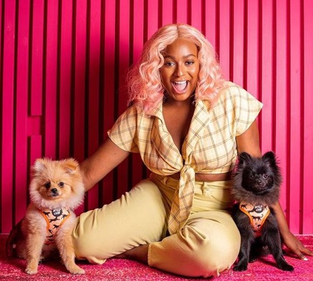 DJ Cuppy with her pet dogs Dudu and FunFun Otedola