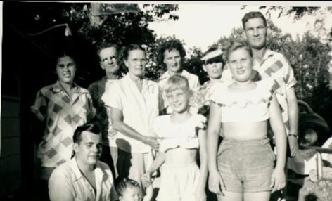 A picture of child Judy Helkenberg with her family