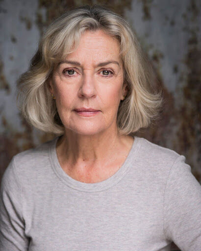 Photo of Catherine Wilkin wearing a grey t-shirt