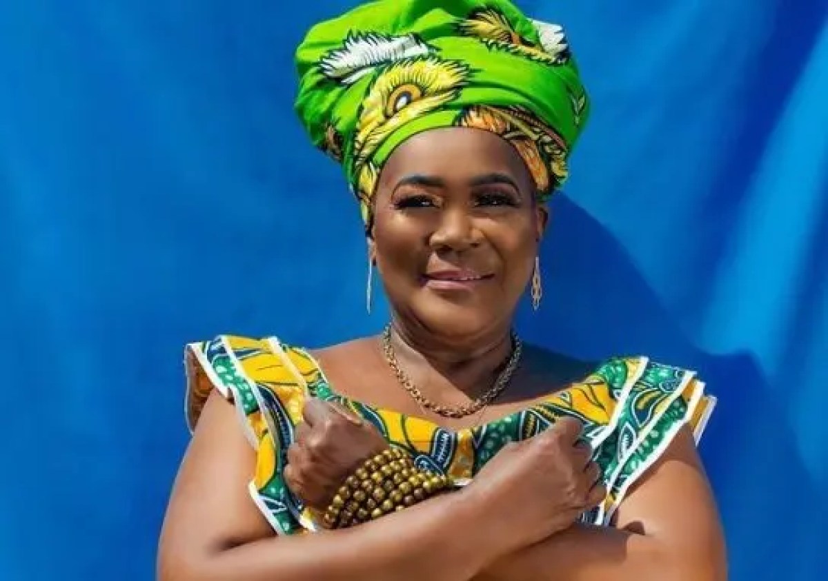 Connie Chiume wearing green dress
