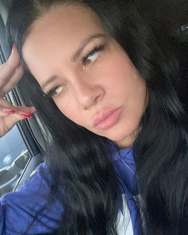 Karen Gravano posing for her Instagram feed by wearing blue hoodie.