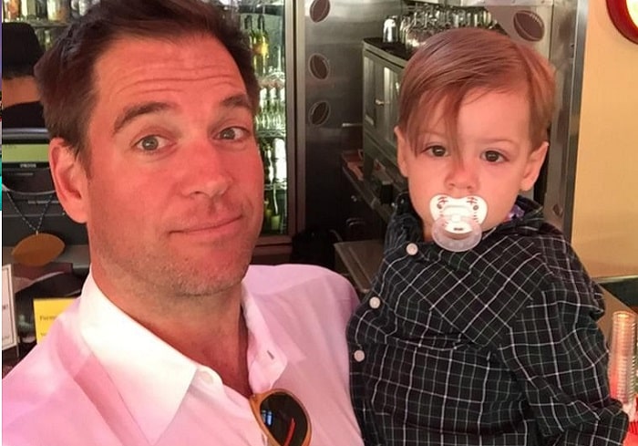 Liam Weatherly's father Michael weatherly carrying Liam