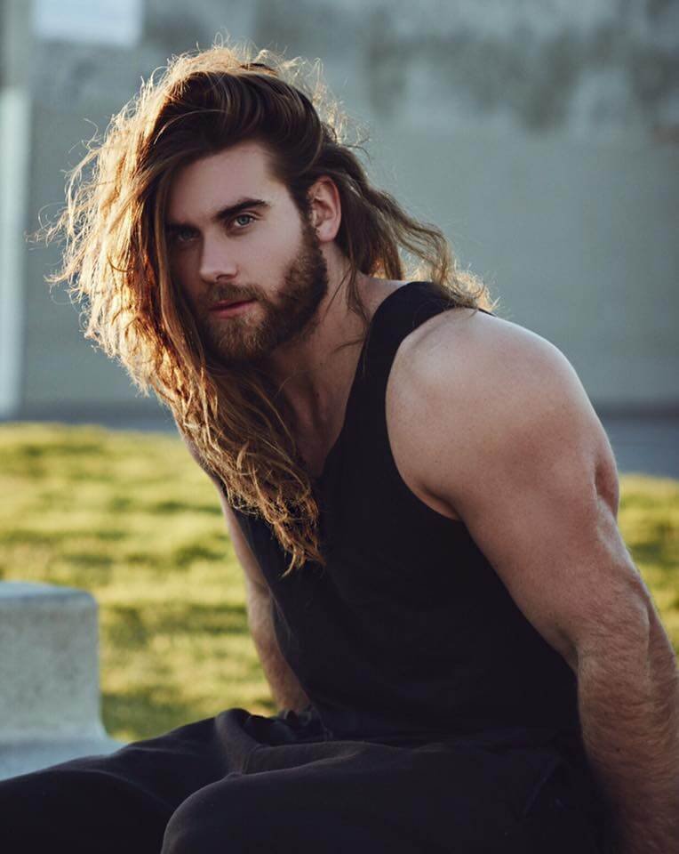 Brock O' Hurn showing his body and a long hair.