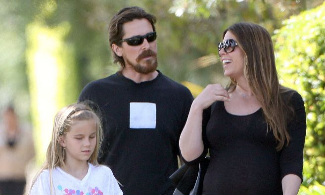 Emmeline Bale and her father Christian Bale and  her mother Sibi Blažić  in a frame.