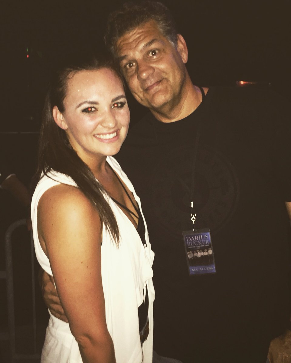 Sydney Golic with her father Mike Golic posing for the photo wearing white gown  and black t-shirt by her father.