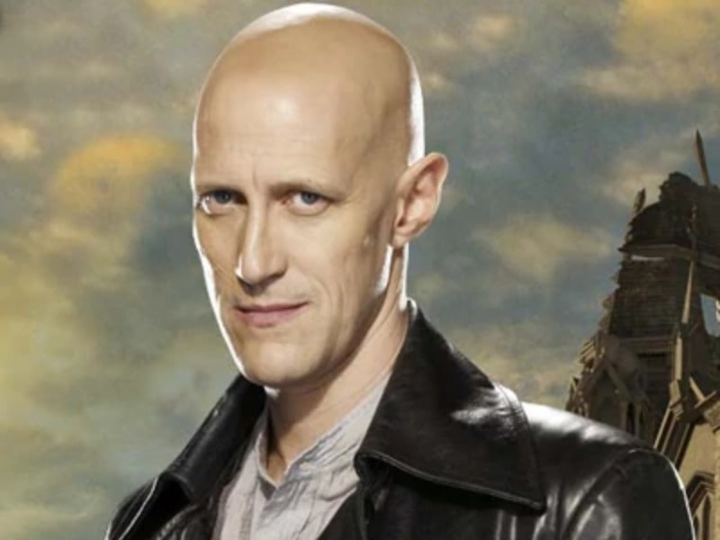 Christopher Heyerdahl in a little bit smiley face with wearing leather jacket
