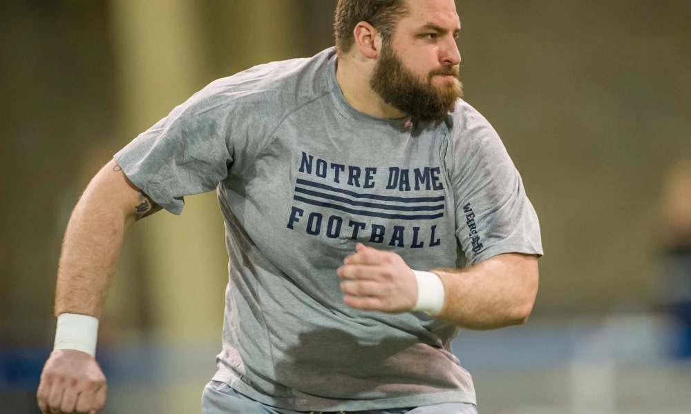 Mike Golic jr captured in a running pose 