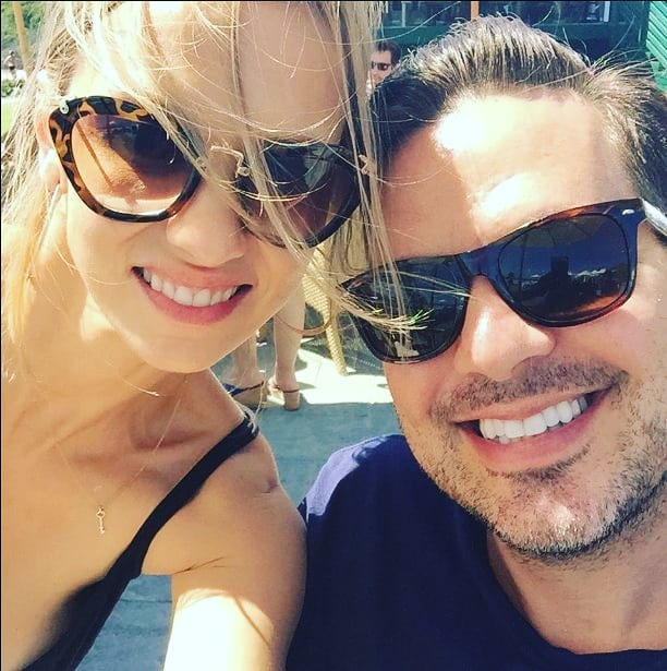 Marnette Patterson posing for the picture with her husband James Verzino wearing sunglasses