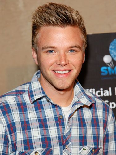 Brett Davern was captured in a smiley face wearing shirt