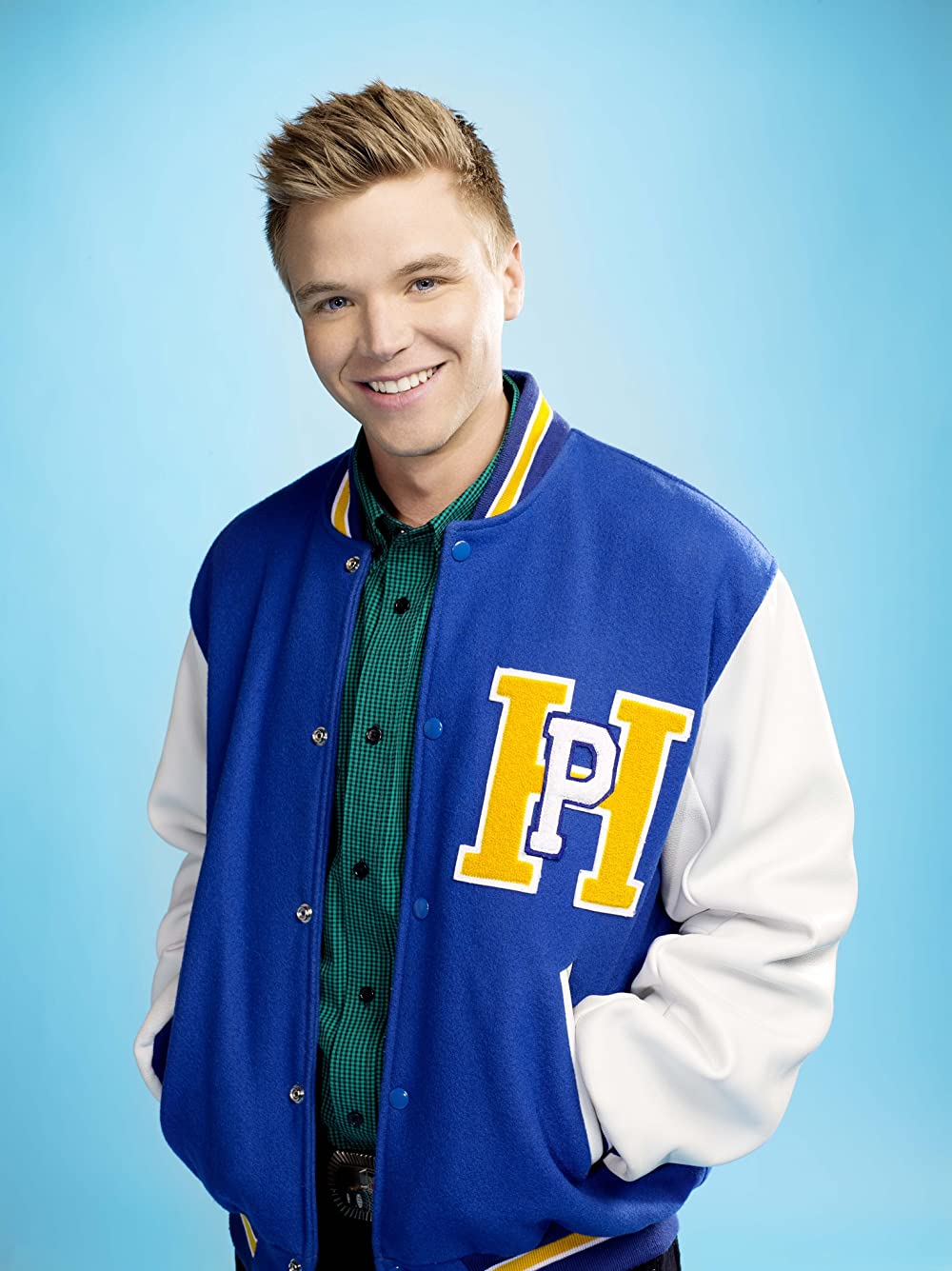 Brett Davern was captured in a smiley face wearing blue and white wind cheater 