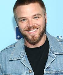 Brett Davern was captured in a smiley face wearing jeans jacket 