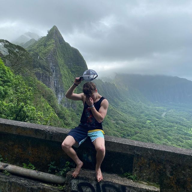 Ethan Wacker posing in the forest of Hawaii in the occasion of world earth day