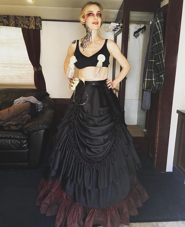 Picture of Amanda Walsh posing for a photoshoot wearing black color gown