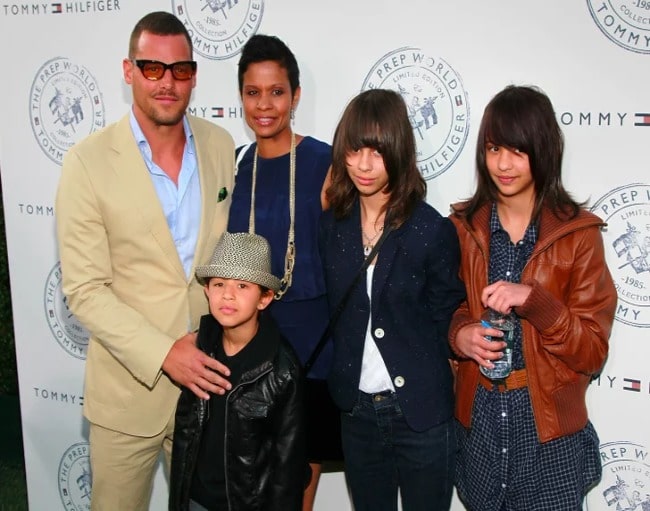 Picture of Kaila's Chamber family posing for a photoshoot in an event wearing brown color blazer and pant