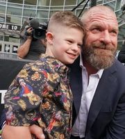 Picture of Vaughn Evelyn Levesque with his father, Triple H.