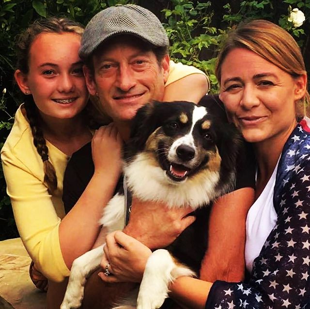 Kyra Monique Kotsur posing with her father, Troy Kotsur and her mother, Deanne Bray along with their pet, Stellaaa.