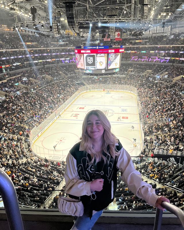Miranda McKeon enjoyed the hockey game along with her friends wearing bassball jacket